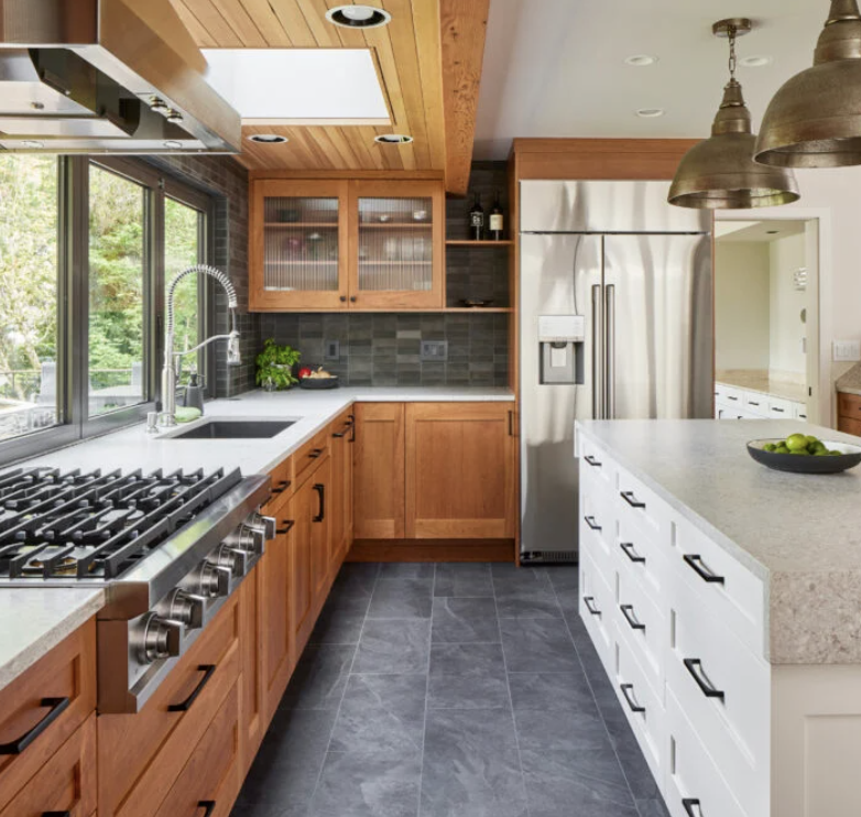 Beautiful finished kitchen renovation featuring custom wood cabinets, premium countertops, and professional-grade appliances showcasing our expert craftsmanship